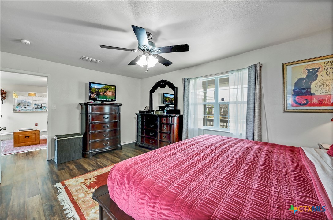 2283 Schwab Road Seguin, TX 78155 - Photo 12 of 40 a bed room with a bed and a flat screen tv