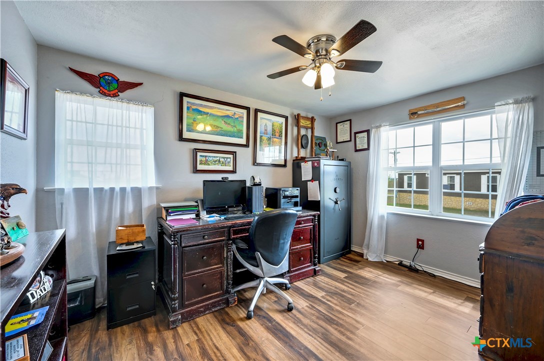 2283 Schwab Road Seguin, TX 78155 - Photo 14 of 40 a view of a workspace with furniture and a window
