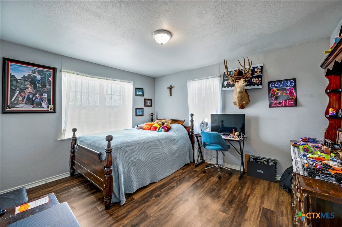 2283 Schwab Road Seguin, TX 78155 - Photo 15 of 40 a bed room with a bed and a chair