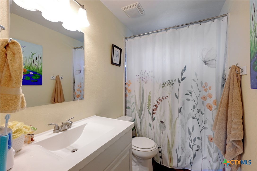 2283 Schwab Road Seguin, TX 78155 - Photo 17 of 40 a bathroom with a sink and a mirror