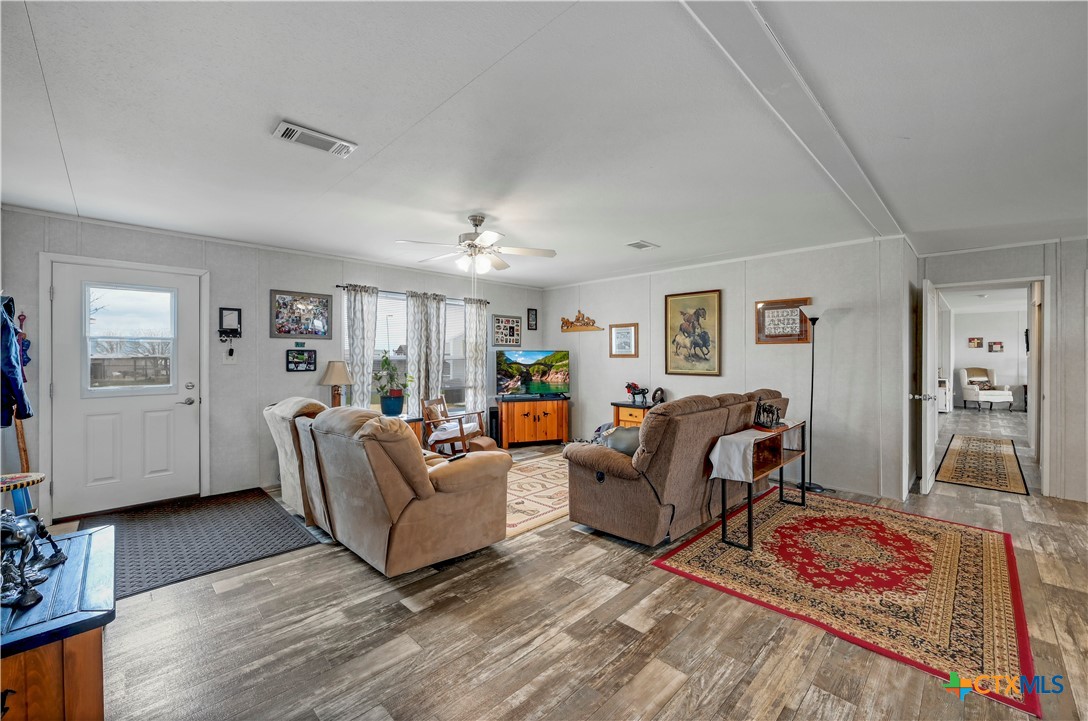2283 Schwab Road Seguin, TX 78155 - Photo 20 of 40 a living room with furniture and a wooden floor