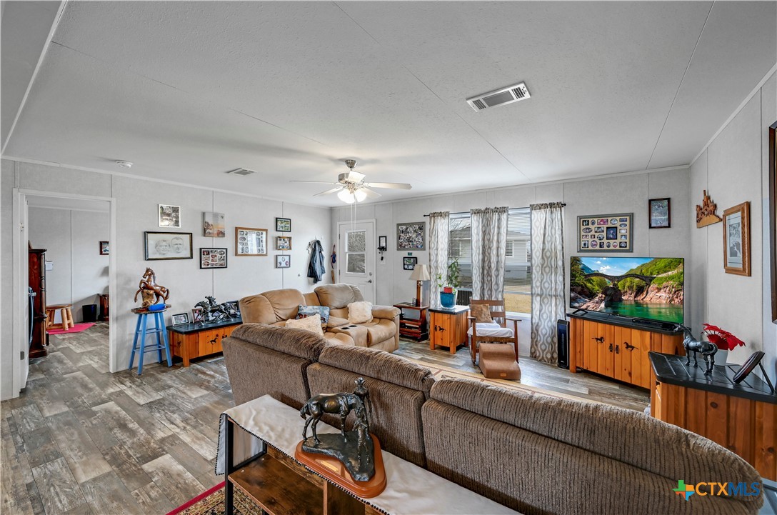 2283 Schwab Road Seguin, TX 78155 - Photo 21 of 40 a living room with furniture and a flat screen tv