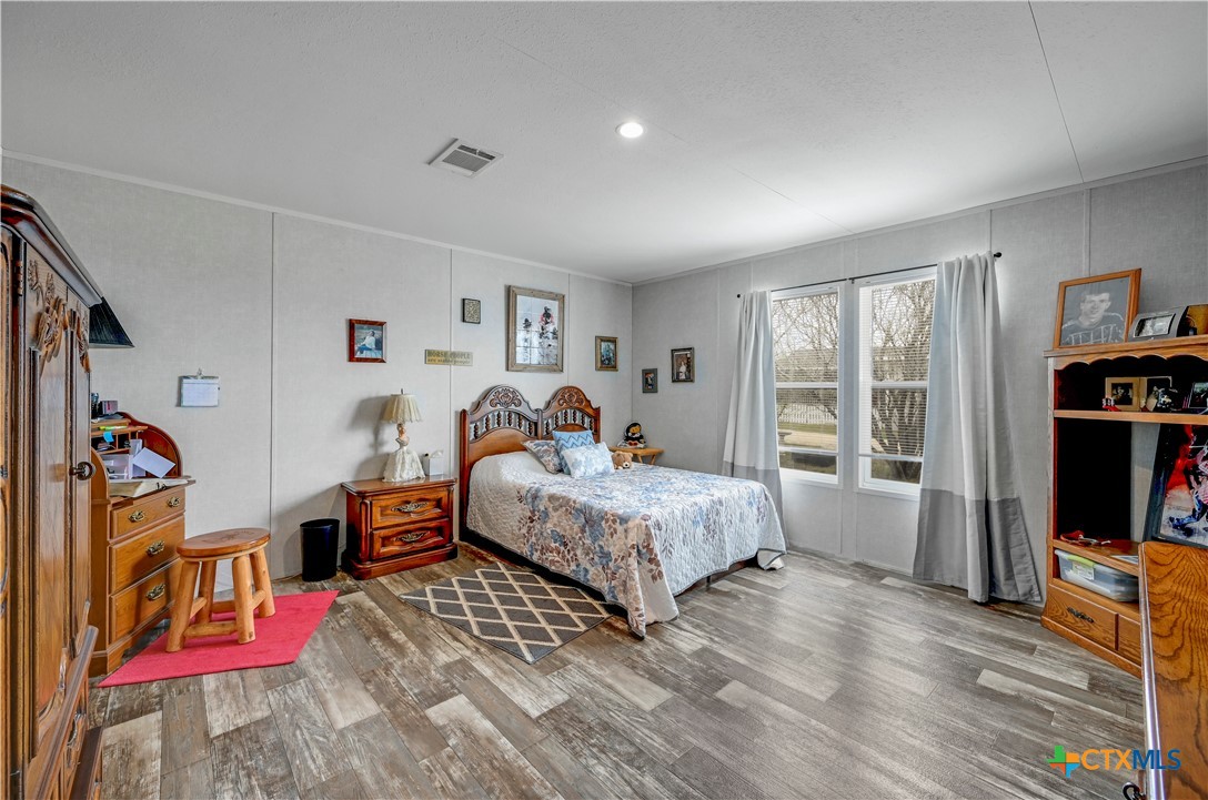 2283 Schwab Road Seguin, TX 78155 - Photo 26 of 40 a spacious bedroom with a bed and a large window