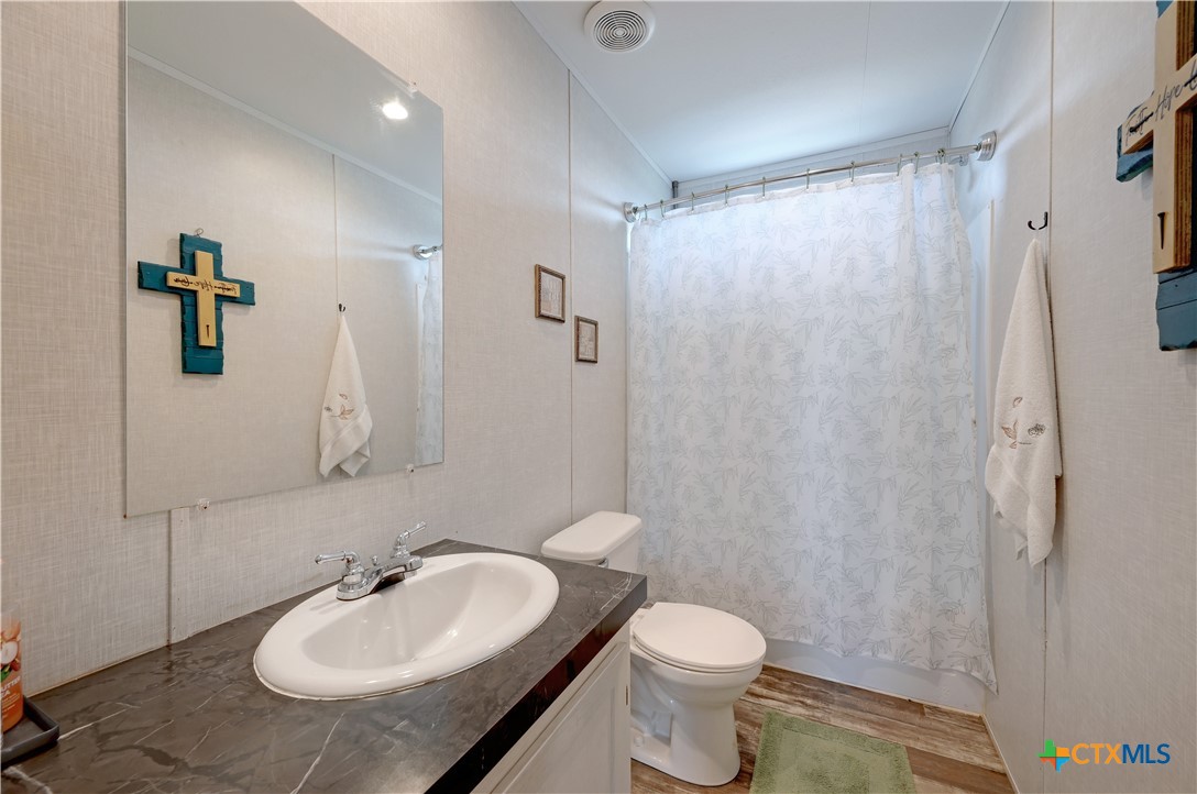 2283 Schwab Road Seguin, TX 78155 - Photo 34 of 40 a bathroom with a sink toilet and shower