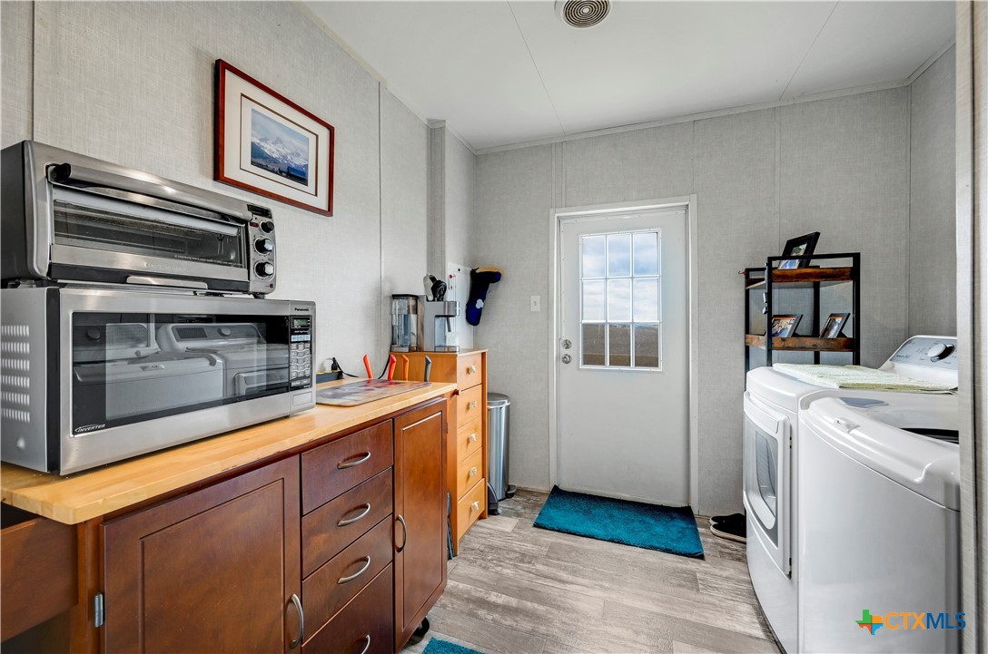 2283 Schwab Road Seguin, TX 78155 - Photo 35 of 40 a kitchen with a stove and a refrigerator