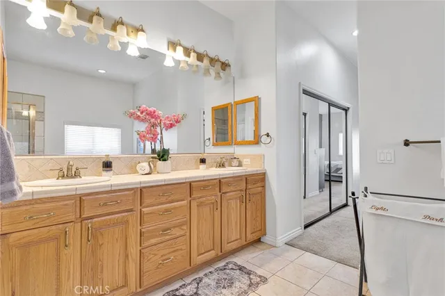 a bathroom with a sink and vanity