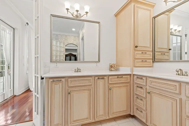 a bathroom with a toilet a sink and a mirror