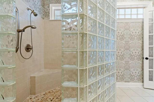 a bathroom with a toilet a sink and a mirror