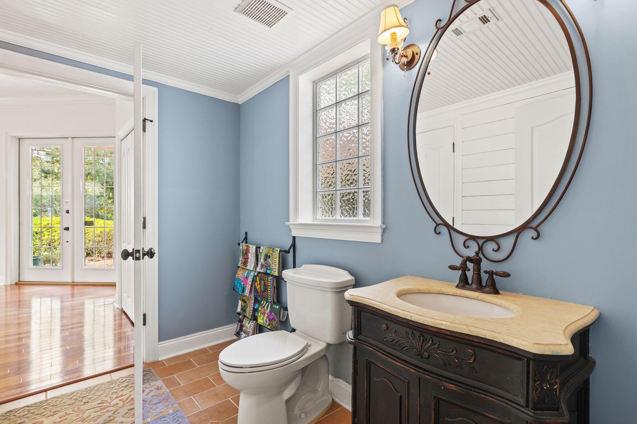 31 Seabreeze Place Inlet Beach, FL 32461 - Photo 18 of 67 a bathroom with a toilet a sink and a mirror