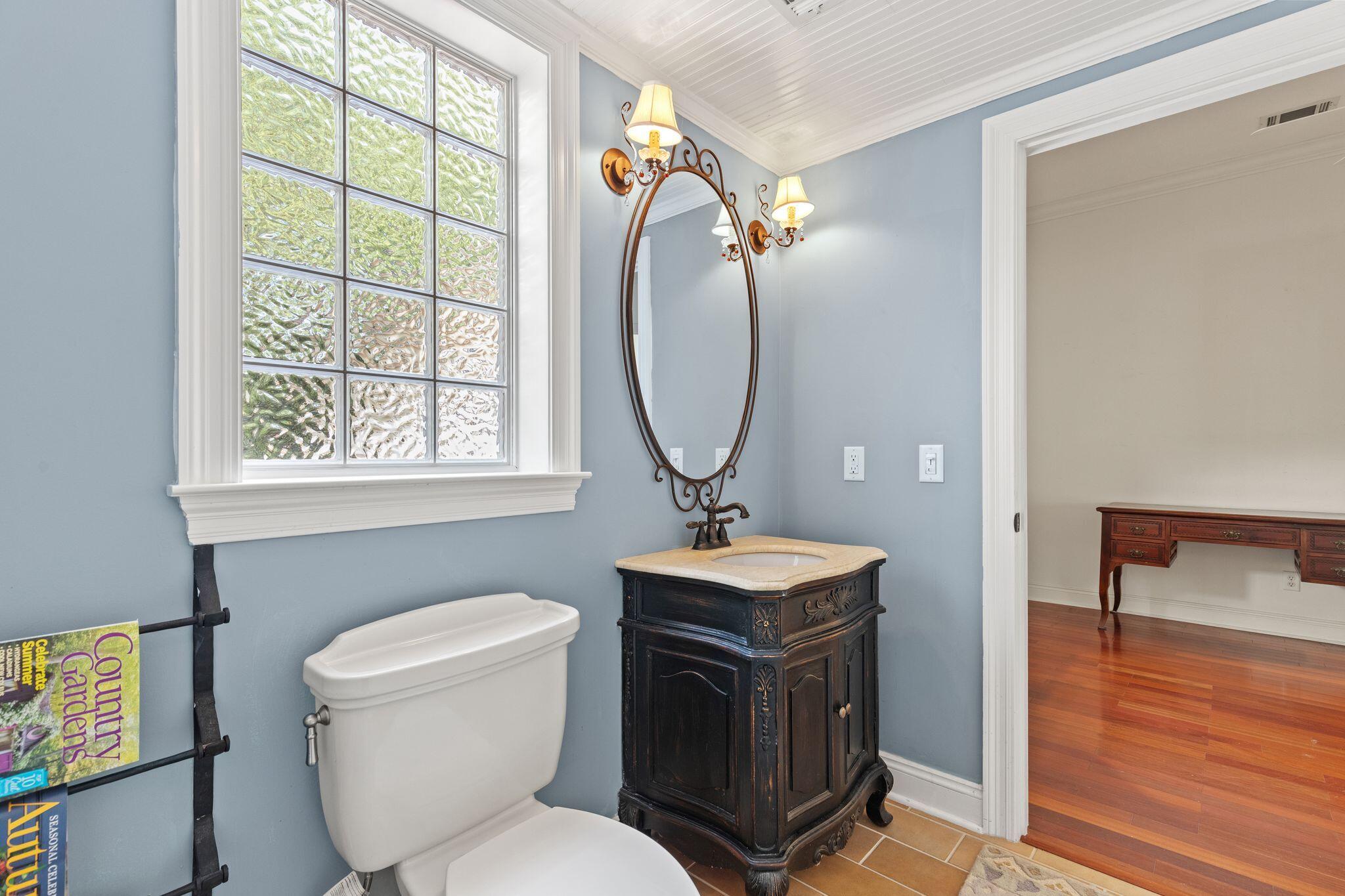 31 Seabreeze Place Inlet Beach, FL 32461 - Photo 19 of 67 a bathroom with a toilet a sink and a mirror