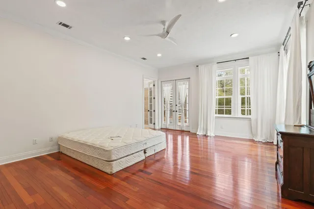 a view of a kitchen with furniture and wooden floor