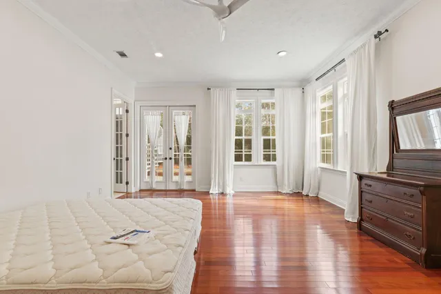 a view of empty room with wooden floor and fireplace