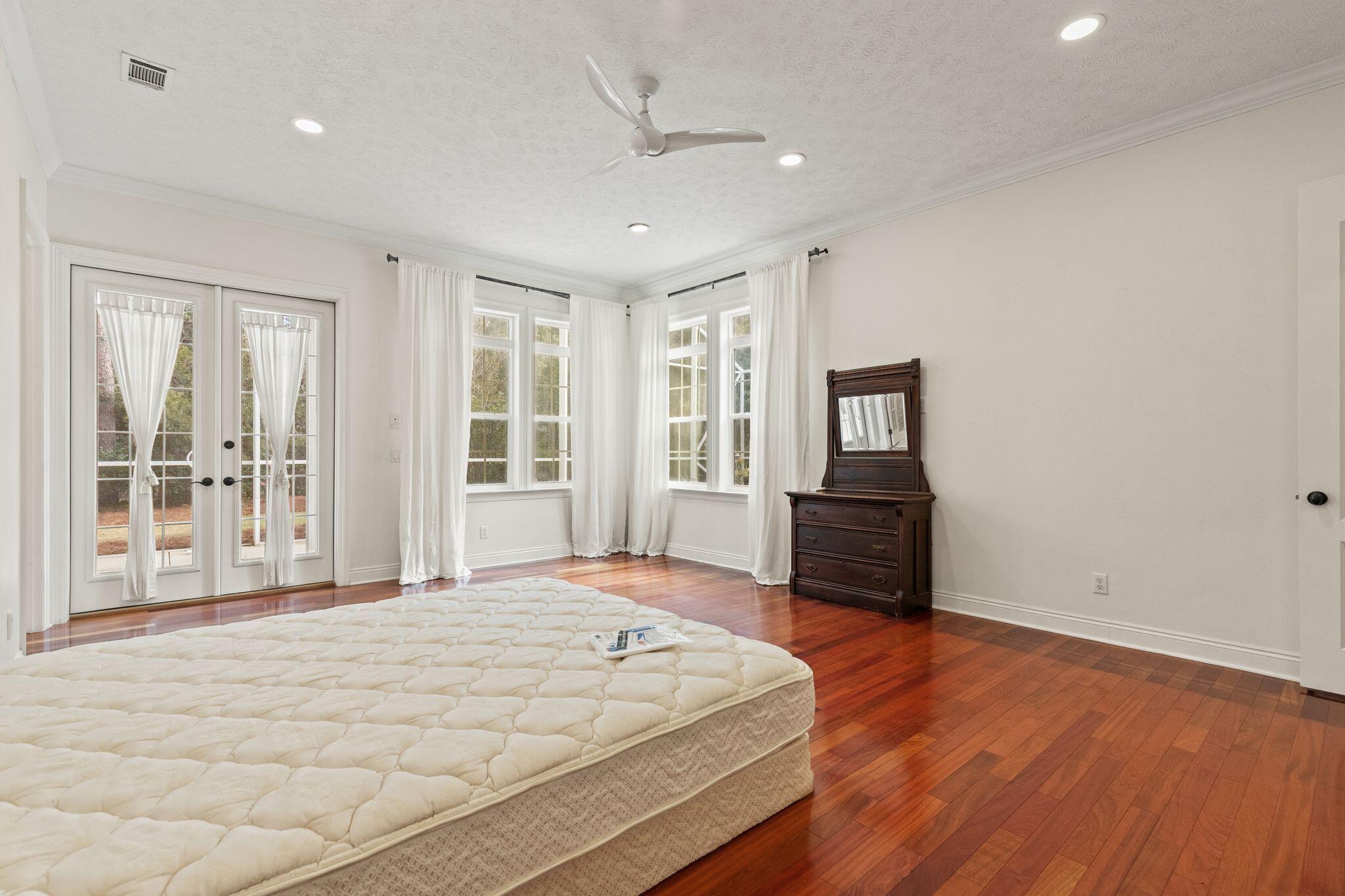 31 Seabreeze Place Inlet Beach, FL 32461 - Photo 22 of 67 a spacious bedroom with a bed and wooden floor