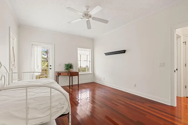 a living room with furniture a fireplace and a floor to ceiling window