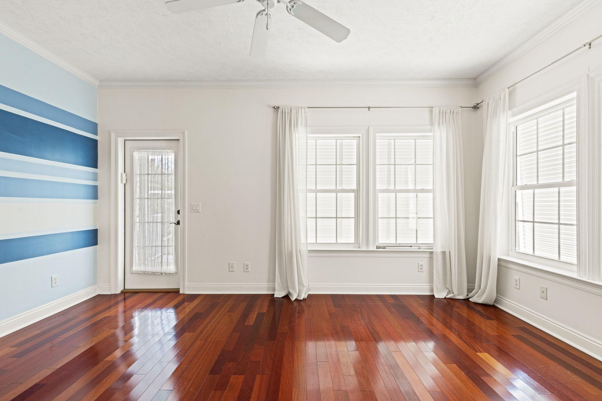 31 Seabreeze Place Inlet Beach, FL 32461 - Photo 39 of 67 an empty room with wooden floor and windows