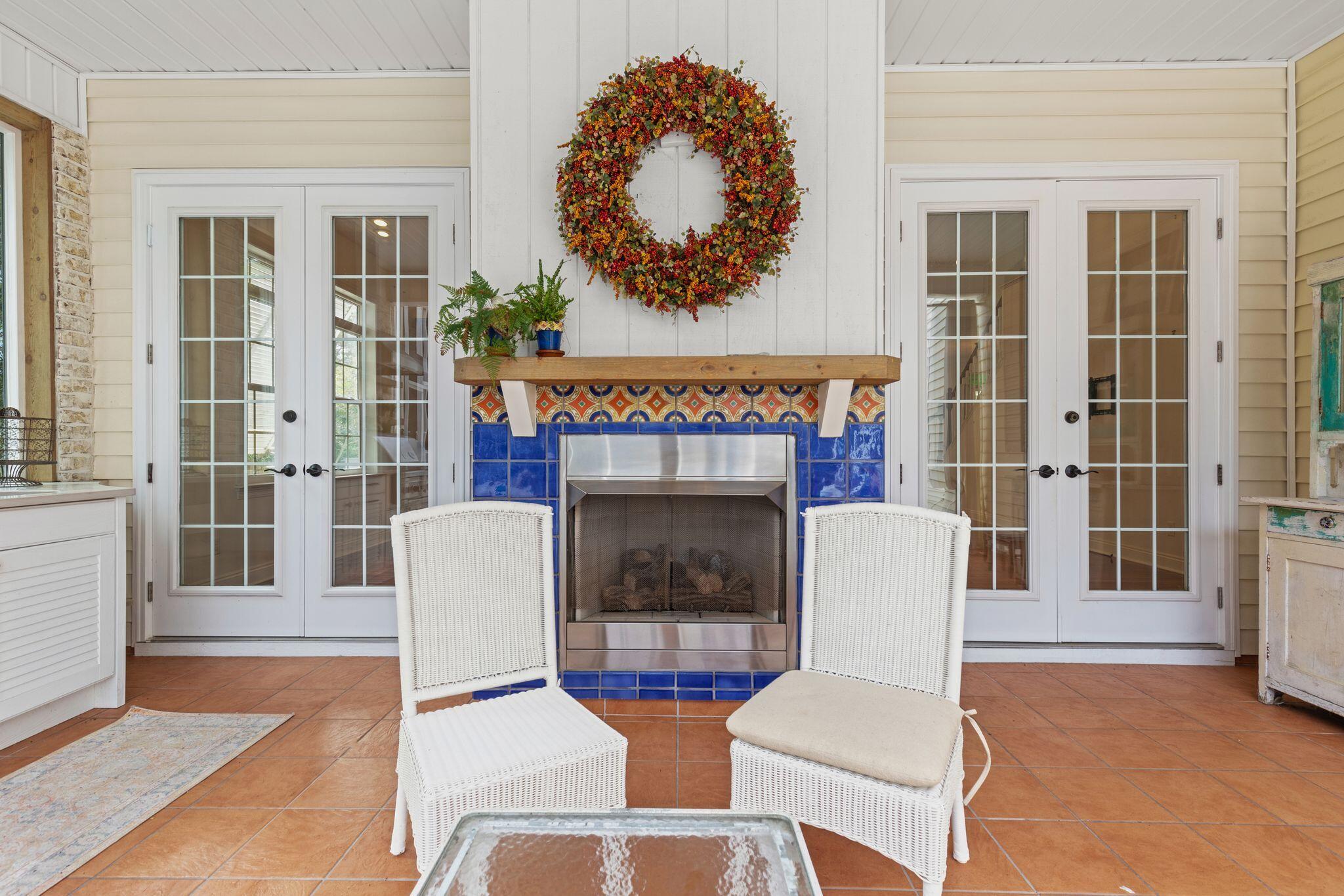 31 Seabreeze Place Inlet Beach, FL 32461 - Photo 46 of 67 a living room with furniture a fireplace and a floor to ceiling window