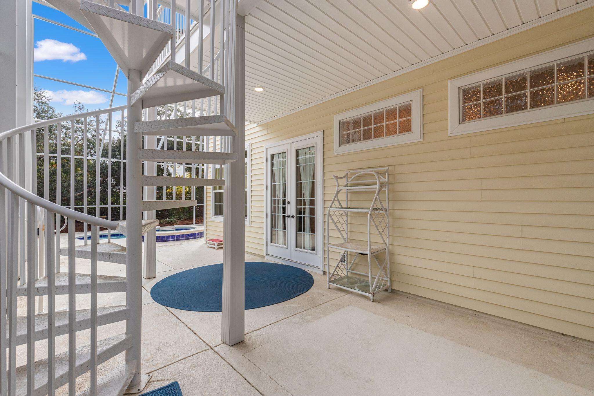 31 Seabreeze Place Inlet Beach, FL 32461 - Photo 53 of 67 a view of a porch with a table and chairs