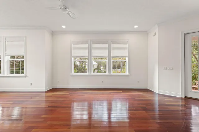 a view of an empty room and wooden floor
