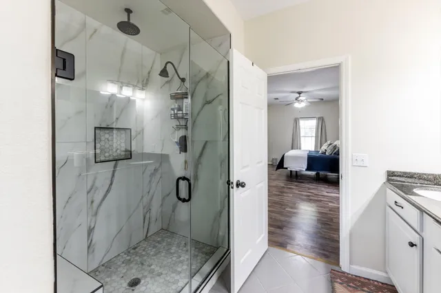 a bathroom with a sink and shower