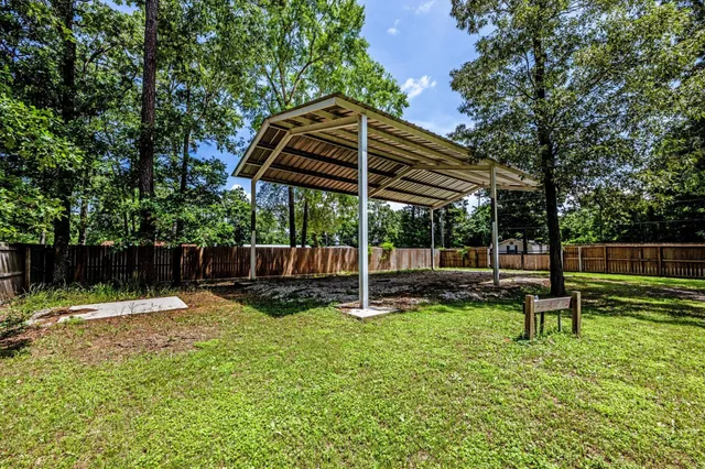 a view of a chair and table under the umbrella