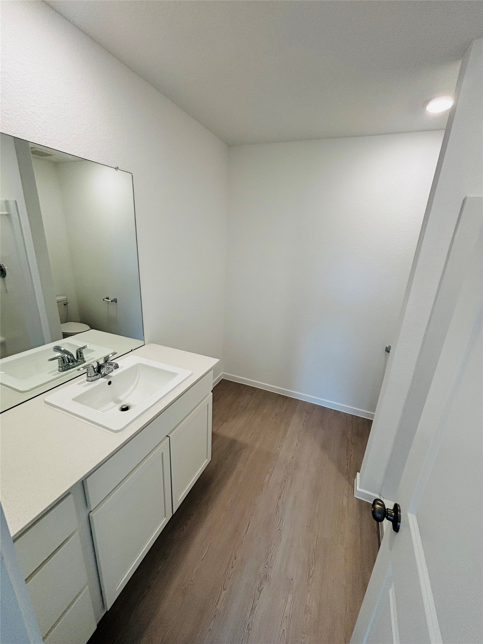 2126 Mosaic Vly Court Angleton, TX 77515 - Photo 23 of 40 a bathroom with a sink toilet and mirror