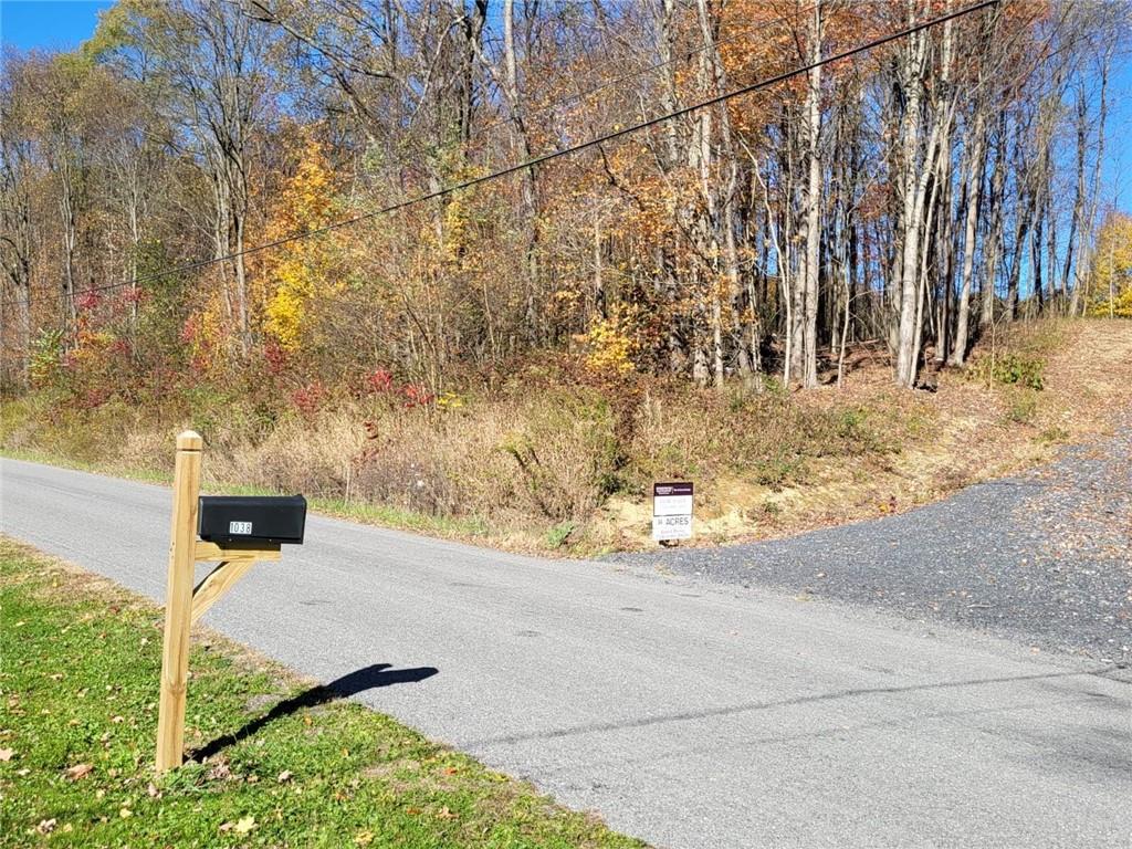 1038 Beatty School Road Greenville, PA 16125 - Photo 2 of 9 a view of a yard with wooden fence