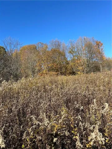 a view of a large building with mountains in the background