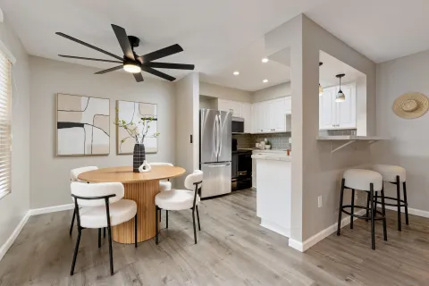 a view of a dining room with furniture and wooden floor