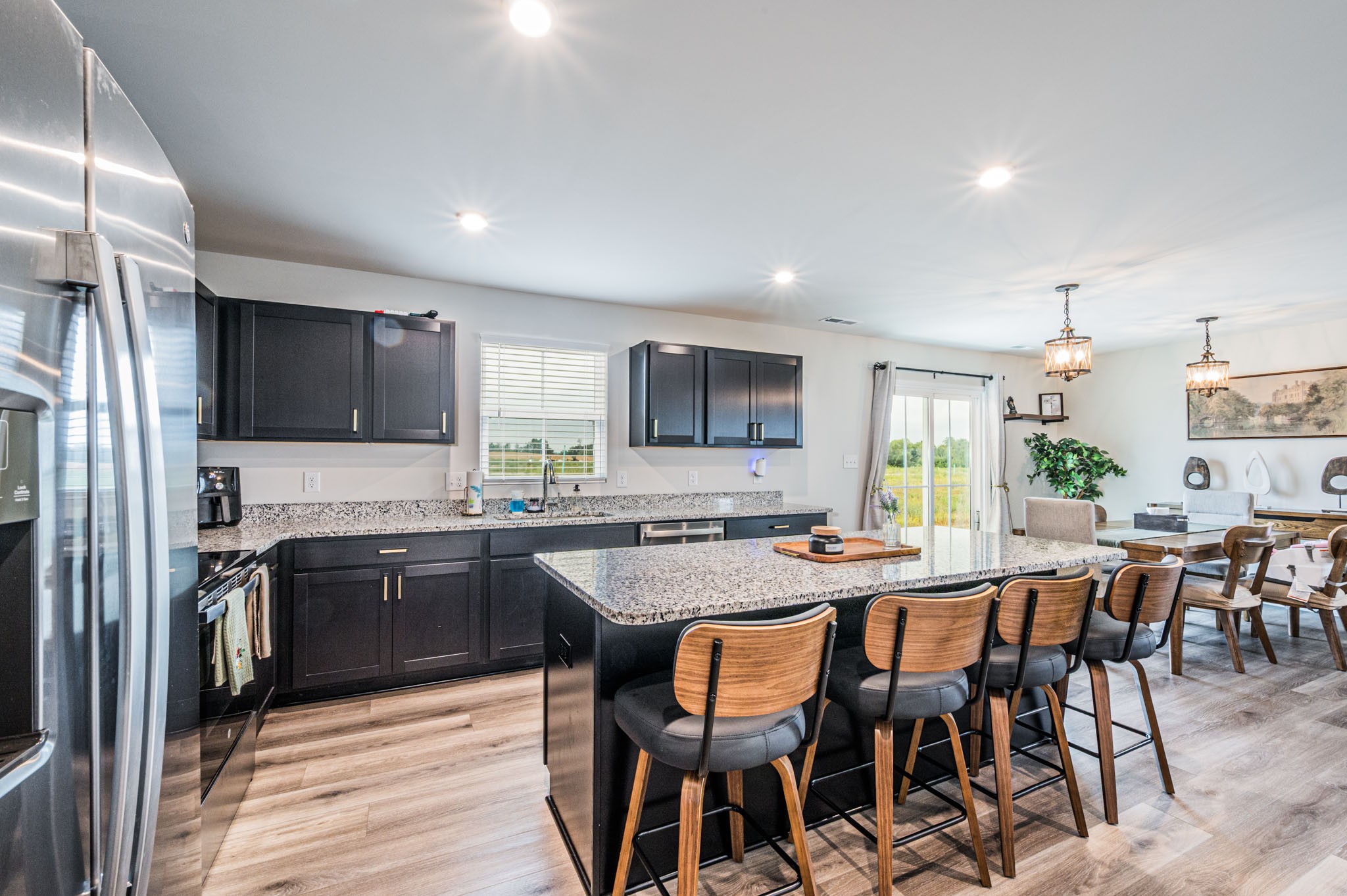 119 Amberleaf Circle Franklin, KY 42134 - Photo 8 of 28 a kitchen with stainless steel appliances granite countertop table chairs stove and refrigerator