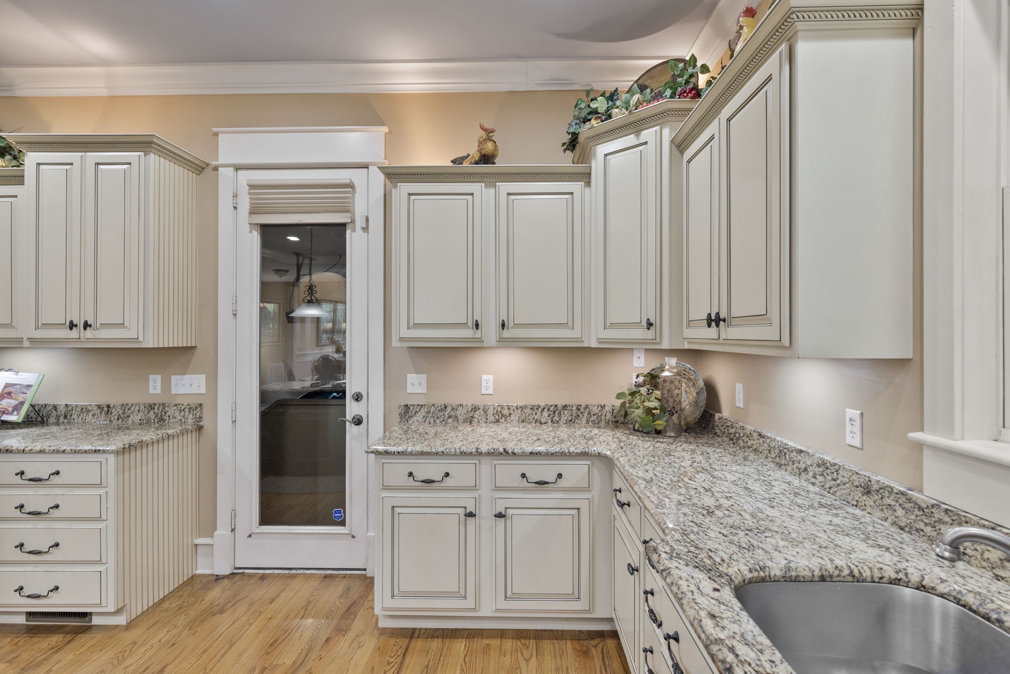 8288 Guthrie Road Cross Plains, TN 37049 - Photo 14 of 94 a kitchen with granite countertop a sink cabinets and stainless steel appliances