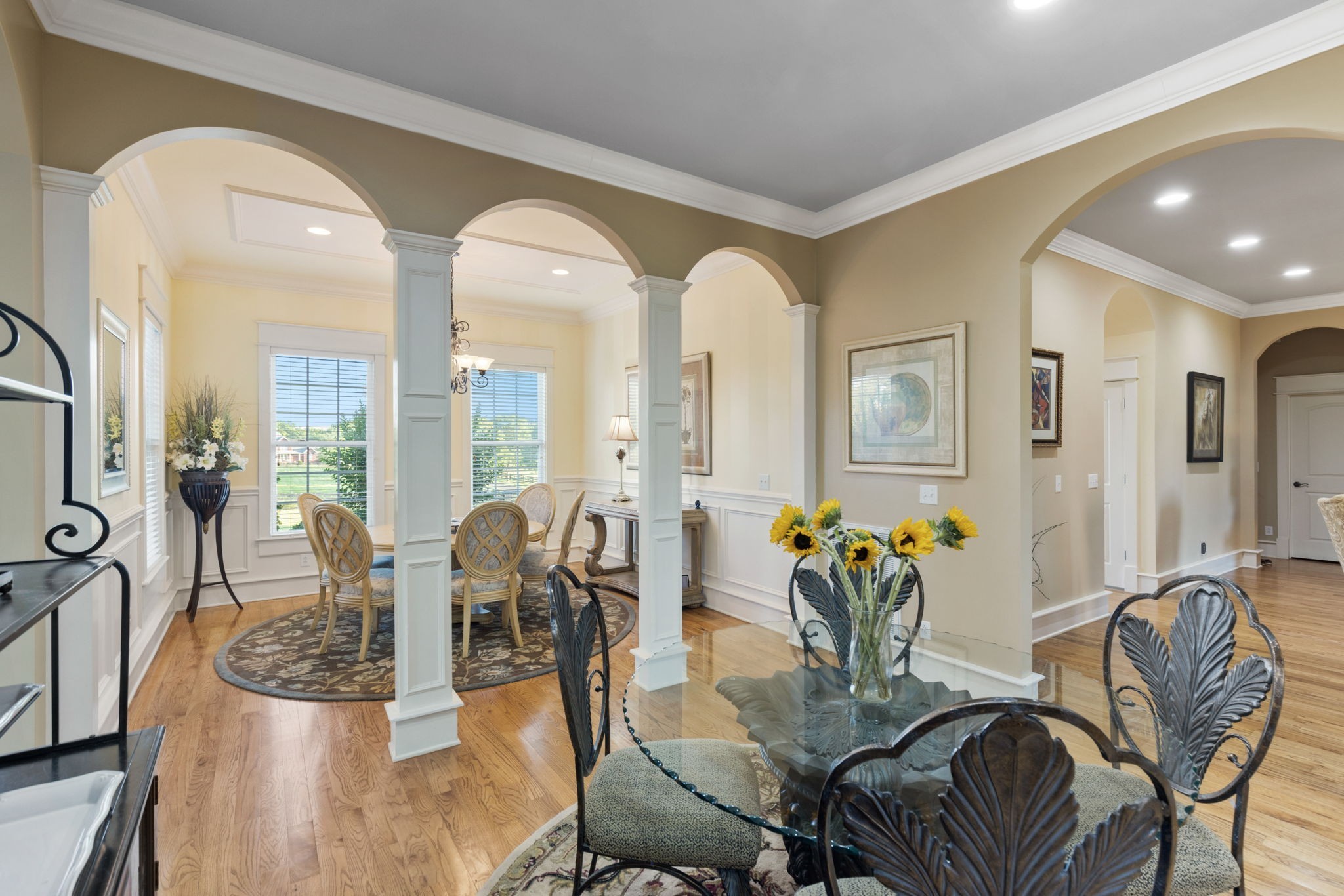 8288 Guthrie Road Cross Plains, TN 37049 - Photo 16 of 94 a dining room with furniture a chandelier and wooden floor