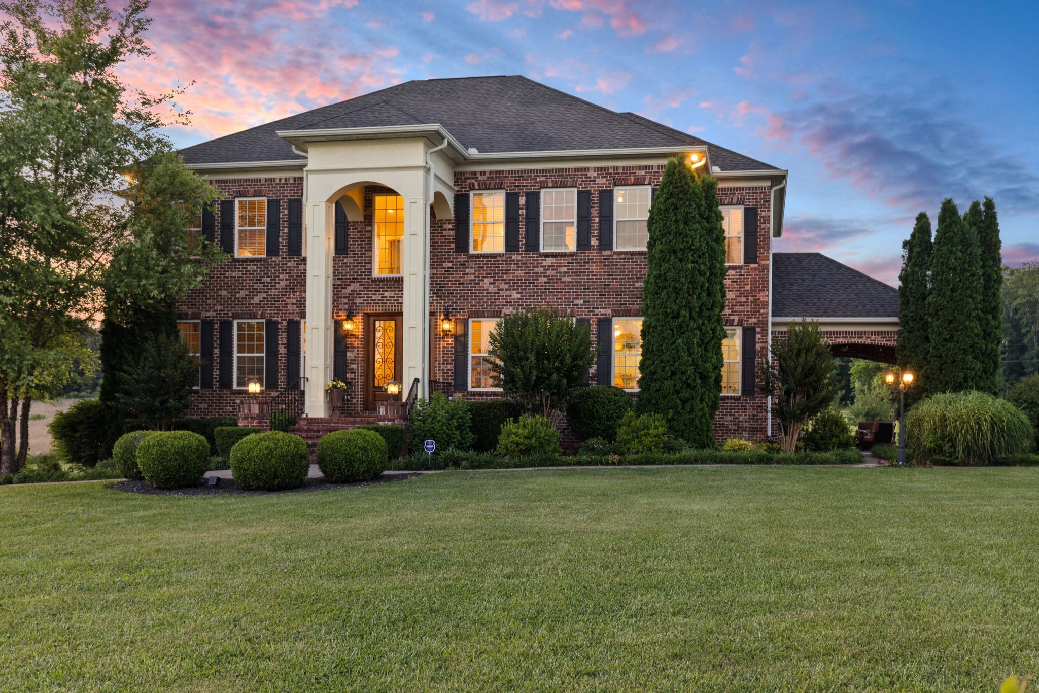 8288 Guthrie Road Cross Plains, TN 37049 - Photo 2 of 94 a front view of a house with garden