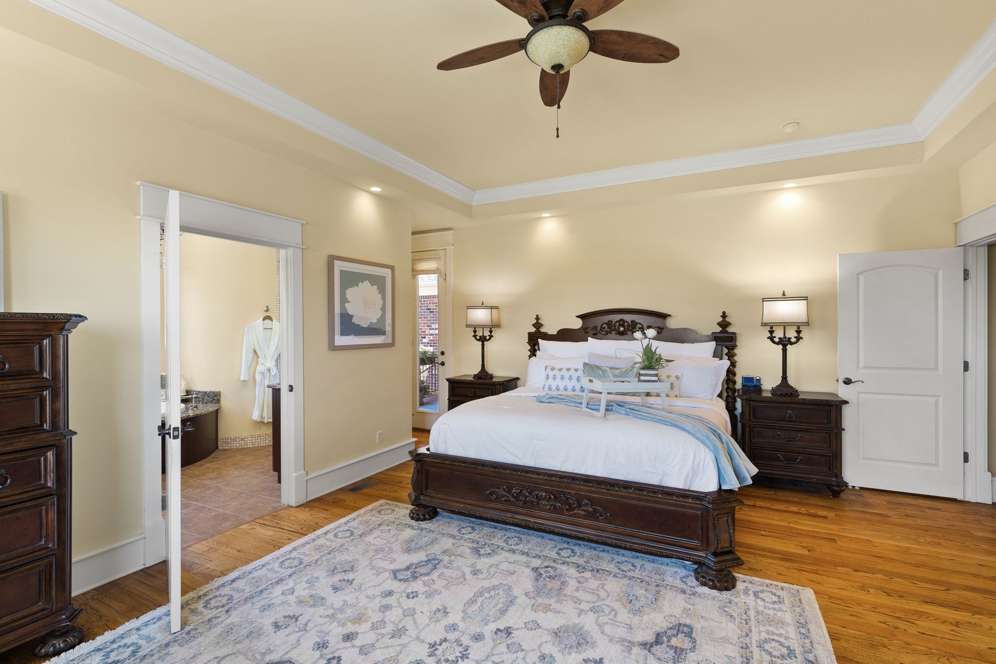 8288 Guthrie Road Cross Plains, TN 37049 - Photo 29 of 94 a bedroom with a bed and a walk in closet with wooden floor