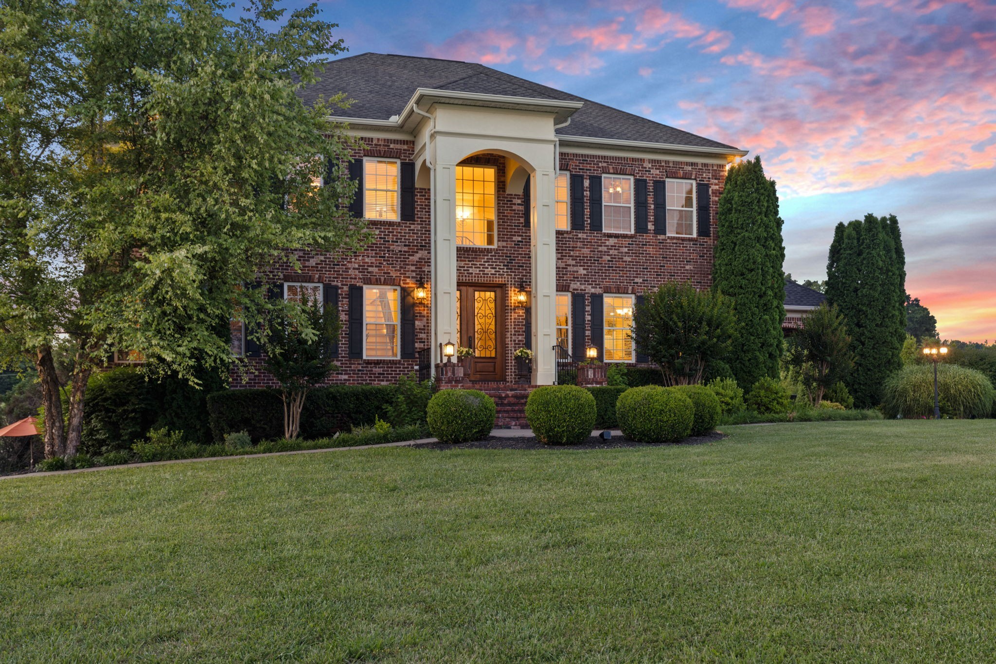 8288 Guthrie Road Cross Plains, TN 37049 - Photo 3 of 94 a front view of a house with a garden