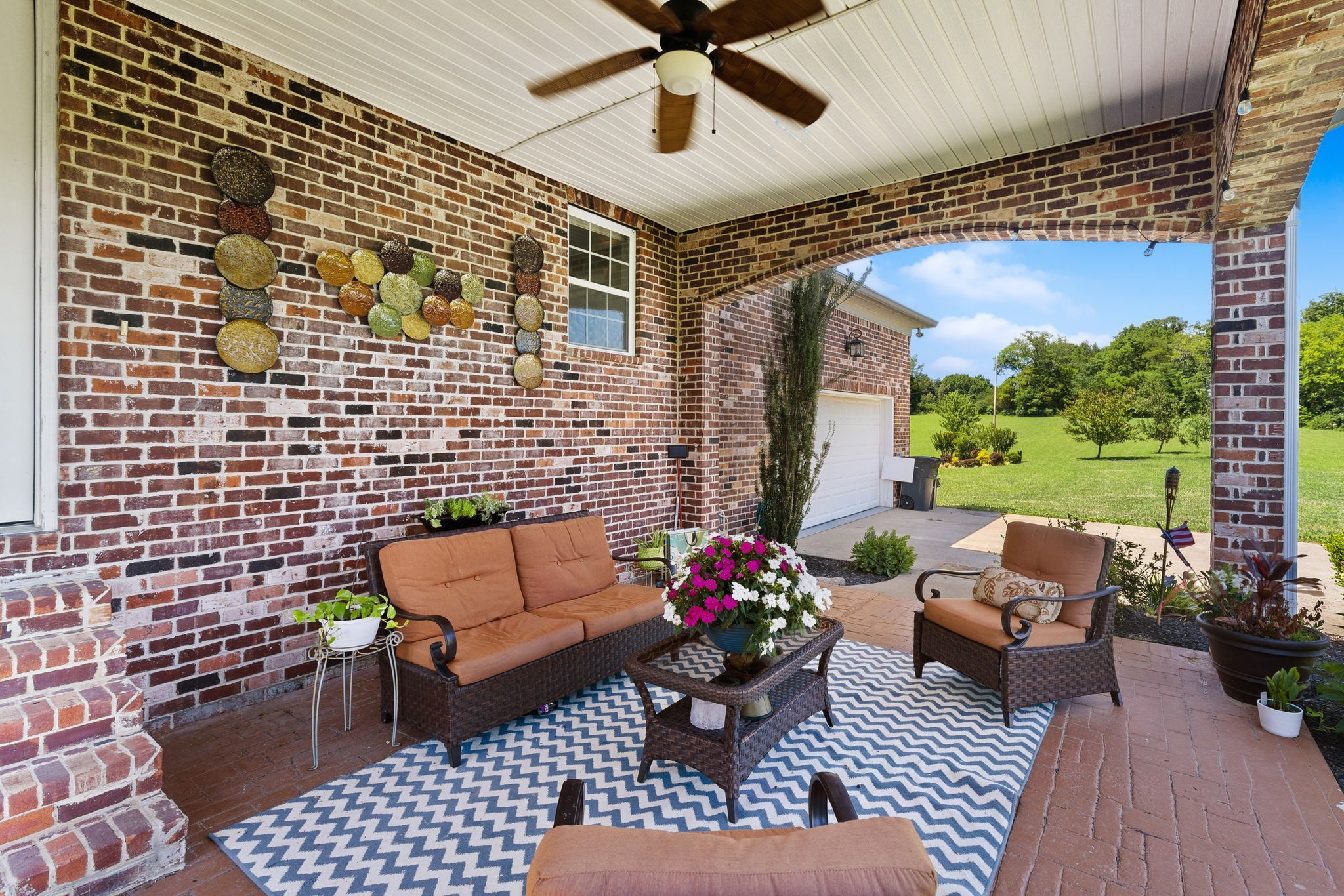 8288 Guthrie Road Cross Plains, TN 37049 - Photo 77 of 94 a outdoor living space with furniture and a potted plant