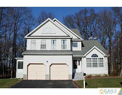 78 Springfield Road North Brunswick, NJ 08902 - Photo 1 of 19 a front view of a house with a yard and garage
