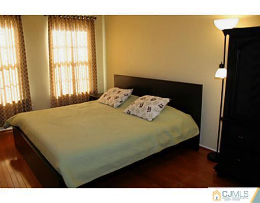 78 Springfield Road North Brunswick, NJ 08902 - Photo 13 of 19 a bedroom with a bed and a window