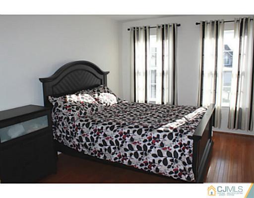 78 Springfield Road North Brunswick, NJ 08902 - Photo 14 of 19 a bedroom with a bed and window