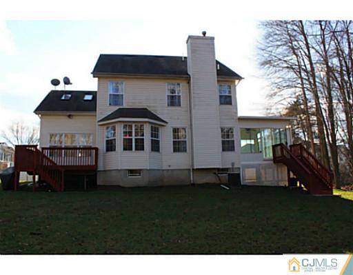 78 Springfield Road North Brunswick, NJ 08902 - Photo 17 of 19 a front view of a house with a garden