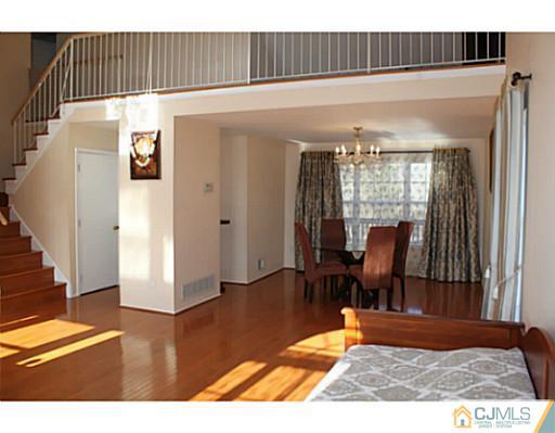 78 Springfield Road North Brunswick, NJ 08902 - Photo 3 of 19 a view of a livingroom with furniture and wooden floor