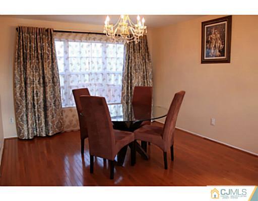 78 Springfield Road North Brunswick, NJ 08902 - Photo 4 of 19 a view of a dining room with furniture and wooden floor
