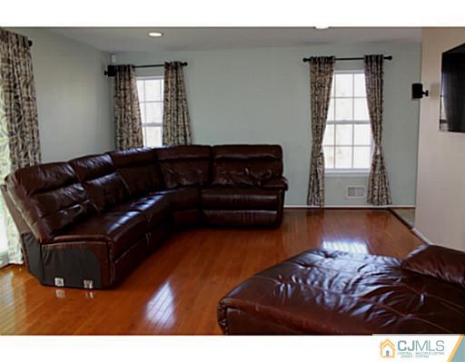 78 Springfield Road North Brunswick, NJ 08902 - Photo 7 of 19 a living room with furniture window and wooden floor