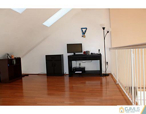 78 Springfield Road North Brunswick, NJ 08902 - Photo 10 of 19 a living room with furniture and a flat screen tv