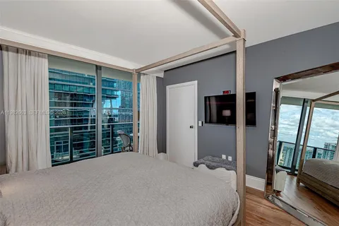 a bedroom with a bed and walk in closet