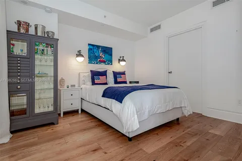 a bedroom with a bed and a view of bedroom