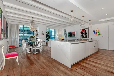 a view of kitchen with cabinets and wooden floor