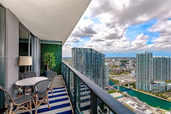 a balcony view with couple of chairs