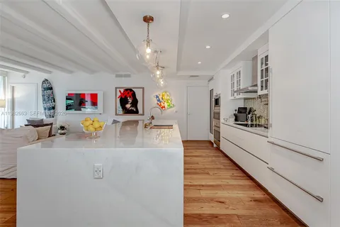 a large kitchen with stainless steel appliances granite countertop a lot of counter top space