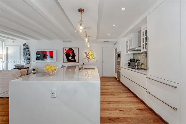 a large kitchen with stainless steel appliances granite countertop a lot of counter top space
