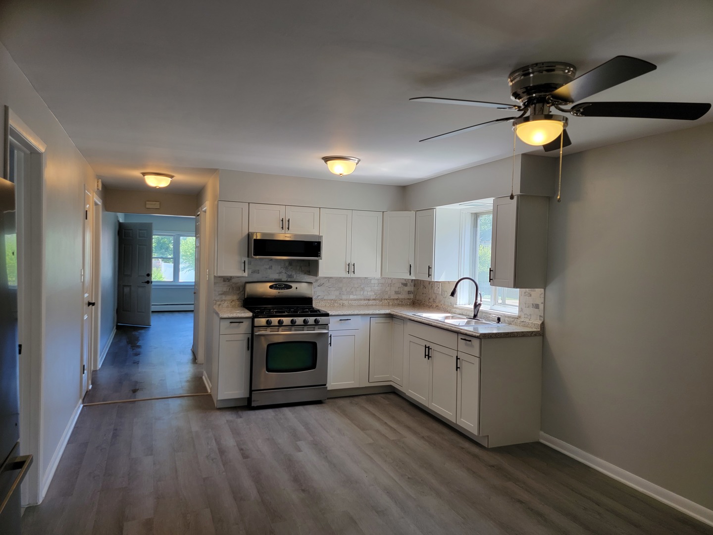 912 State Street, Unit 2 Lemont, IL 60439 - Photo 14 of 25 a kitchen with stainless steel appliances granite countertop a stove and a sink